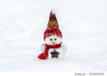 Merry christmas and happy new year greeting card with copy space Happy little snowman in red cap and scarf standing in winter snow background Xmas fairytale Hello January, February concept 85909365