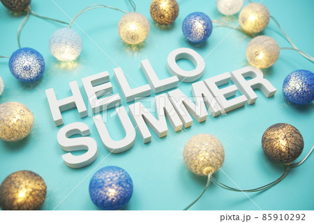 Hello Summer alphabet letter decorate with LED cotton balls on blue background 85910292