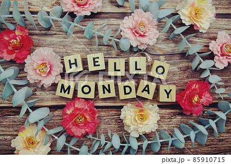 Hello Monday alphabet letter and flower decorate on wooden background 85910715