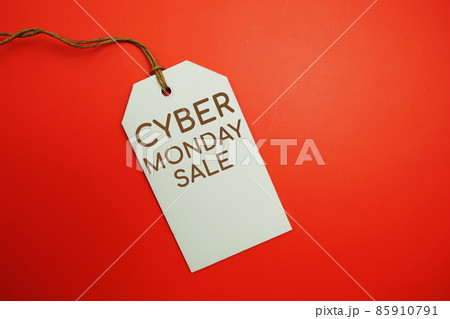 Flat lay Cyber Monday Sale tag on red background 85910791