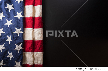 Happy presidents day concept with flag of the United States on dark background. Happy presidents day concept with flag of the United States on dark background. 85912200