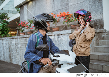 asian man on a motorbike picks up a woman asian man on a motorbike picks up a woman 85912302