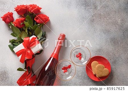 Valentine's day card, sparkling wine, romantic gift and heart shaped cookies. 85917625