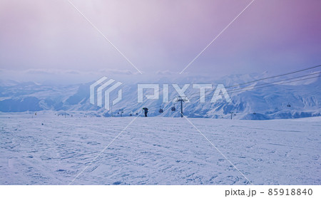 Majestic snowy peaks landscape and pink sky in sunset rays of sun 85918840