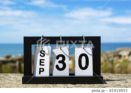Sep 30 calendar date text on wooden frame with blurred background of ocean. Calendar concept 85919955