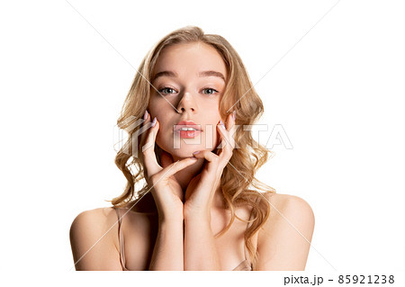 Half-length portrait of young beautiful girl with day makeup isolated over white studio background. Natural beauty concept. 85921238
