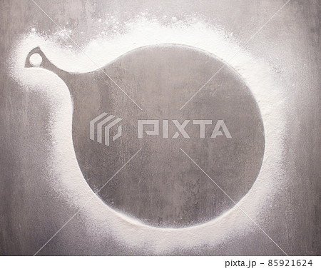 Cutting board and scattered flour powder on stone background top table Cutting board and scattered flour powder on stone background top table 85921624