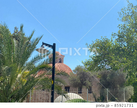 red tile roof of a house and old stone church in a village in the south of France 85921731