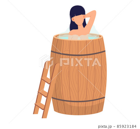 Lady standing in wooden tub with hot water. Home bathhose, spa procedures in wooden water barrel 85923184