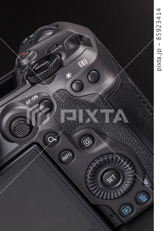 modern professional black digital photo camera controls - buttons, dials, wheels, screens and joystick - close-up macro view 85923414