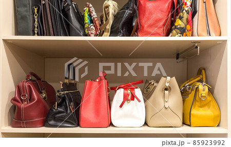 collection of handbags in woman`s closet 85923992