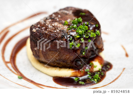 Medium Rare Fillet Mignon Steak with Herb Garlic Butter 85924858