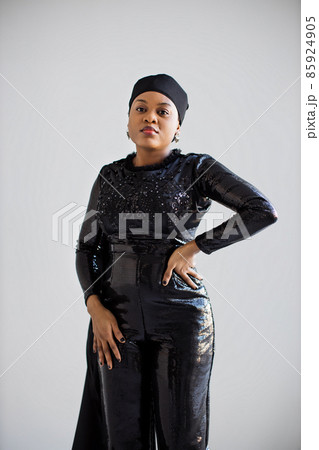 African woman in black evening wear posing indoors African woman in black evening wear posing indoors 85924905