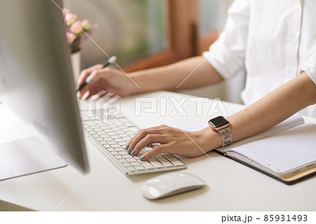 A businesswoman or female working on desktop computer A businesswoman or female working on desktop computer 85931493