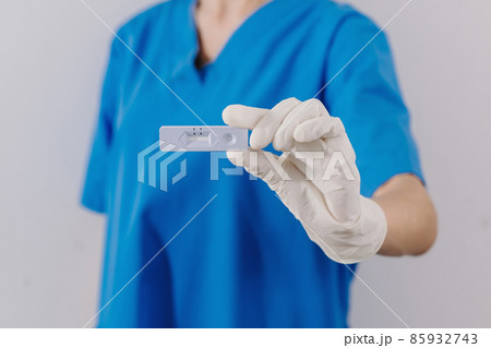 COVID-19 virus disease diagnostic,doctor holding Coronavirus test cassette,rapid strep kit,quick antigen detection testing COVID-19 virus disease diagnostic,doctor holding Coronavirus test cassette,rapid strep kit,quick antigen detection testing 85932743