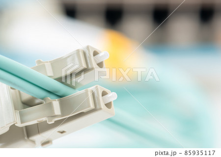 Duplex fiber optic patch cord with connectors type LC close-up Duplex fiber optic patch cord with connectors type LC close-up 85935117