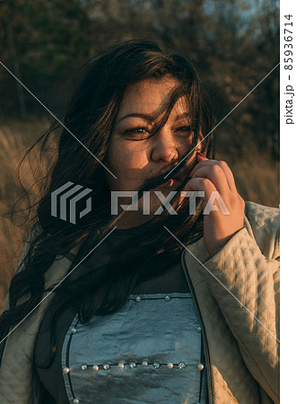 Beautiful plus size asian girl is resting in nature. autumn day 85936714