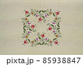 Square napkin of bouquets with red-pink roses and leaves, delicate violets and white flowers on a beige fabric background. 85938847