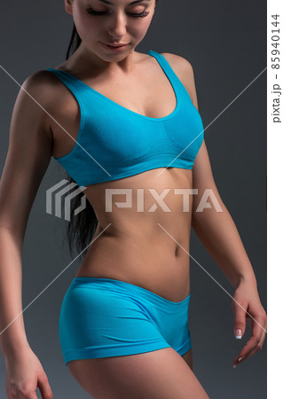 female in sports clothing relaxing after workout female in sports clothing relaxing after workout 85940144