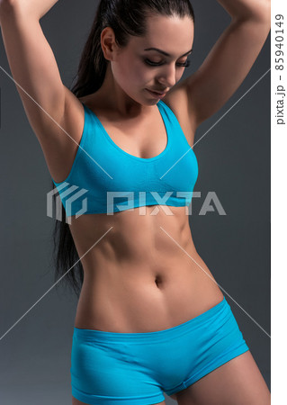 female in sports clothing relaxing after workout female in sports clothing relaxing after workout 85940149