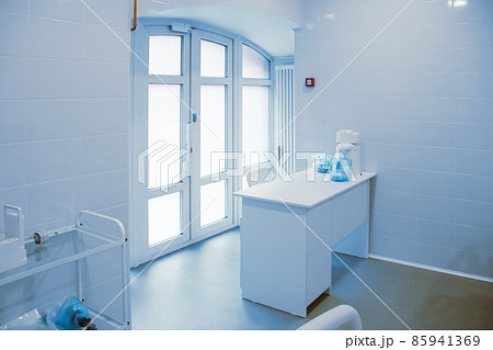 Empty operating room in a hospital. Surgical equipment with operating table. Medical device for emergency patient in blue tone style. Blank Emergency Surgery Room. Clinic interior for background. 85941369