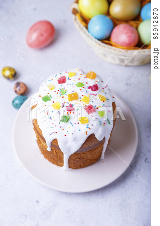Easter cake with candied fruits and colored eggs. Traditional Easter baking. Easter holiday. Close-up. 85942870
