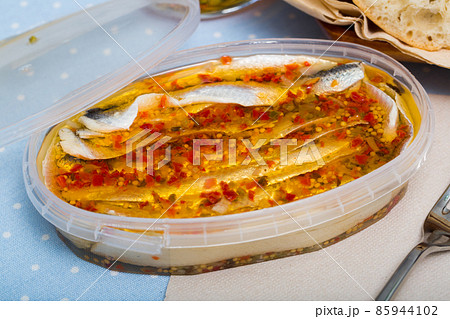 Herring preserves in a plastic jar 85944102
