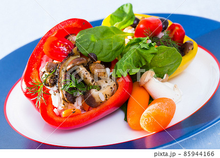 Peppers filled with porcini mushrooms, rice, tomatoes 85944166