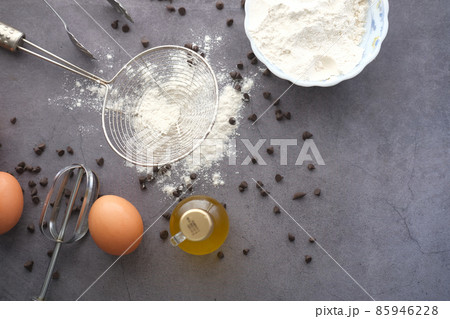 Baking ingredients on a black background, top view. 85946228