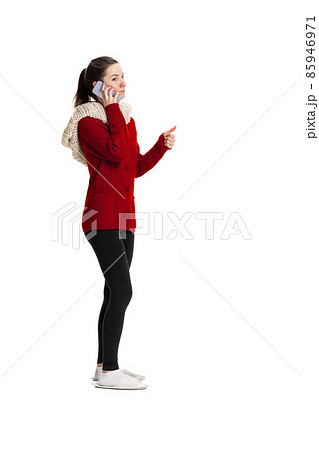 Profile view of sad young girl feeling sick, has running nose wearing warm home clothes isolated over white studio background. Profile view of sad young girl feeling sick, has running nose wearing warm home clothes isolated over white studio background. 85946971