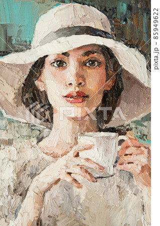A girl in a white hat with a cup of coffee sits in a cafe.  85949622