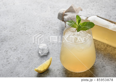 Homemade Kombucha healthy drink in bottle and glass with lemont. 85953878