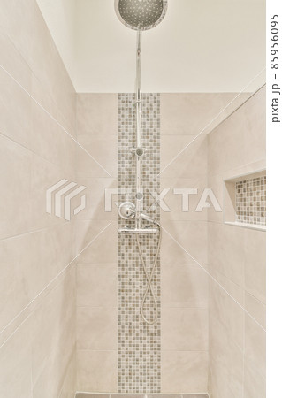 Stylish shower cubicle with mosaic wall in an elegant bathroom 85956095