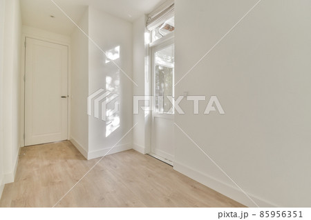 Modern room with wooden floor and white walls 85956351