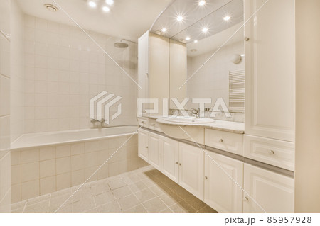 Delightful bathroom with huge mirror and round sink Delightful bathroom with huge mirror and round sink 85957928