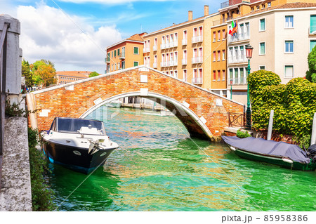 The Boats moored by the bridge in Dorsoduro, a typical old street of Venice, Italy The Boats moored by the bridge in Dorsoduro, a typical old street of Venice, Italy 85958386