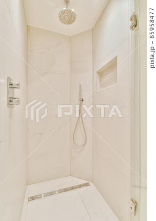 Luxurious bathroom with built-in shower head in the shower Luxurious bathroom with built-in shower head in the shower 85958477