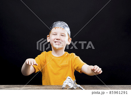 boy with a homemade cap made of aluminum foil boy with a homemade cap made of aluminum foil 85961291