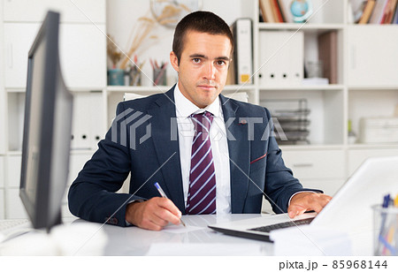 Professional business man using laptop at workplace Professional business man using laptop at workplace 85968144