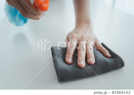 Woman cleaning her house. 85969142