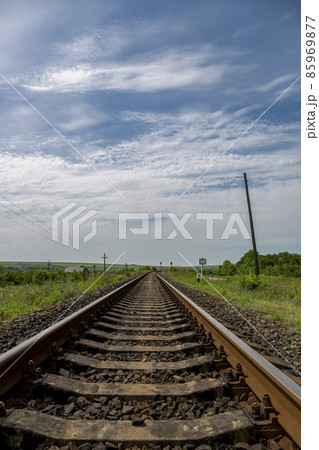 Summer landscape with railroad rails and road 85969877