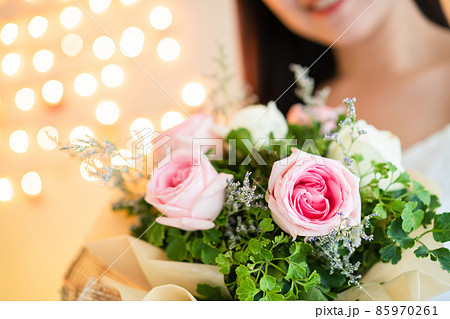 Happy woman holding a beautiful bouquet of flower. 85970261