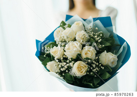 Happy woman holding a beautiful bouquet of flower. 85970263