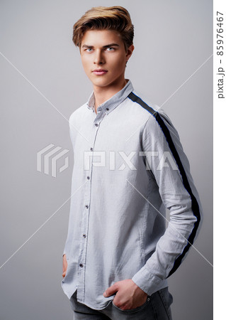 Male hairstyle concept. Handsome man with stylish haircut in stands over white background 85976467