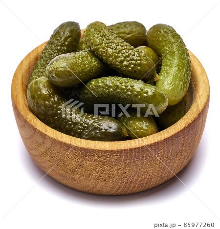 Bowl of Tasty canned Whole green cornichons isolated on a white background Bowl of Tasty canned Whole green cornichons isolated on a white background 85977260