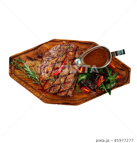 Isolated grilled beef steak with salad and sauce Isolated grilled beef steak with salad and sauce 85977277