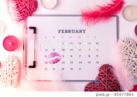 Calendar with 14th of February date. Planning Valentines day holiday. Love romantic dating. Preparing with hearts. Calendar with 14th of February date. Planning Valentines day holiday. Love romantic dating. Preparing with hearts. 85977863