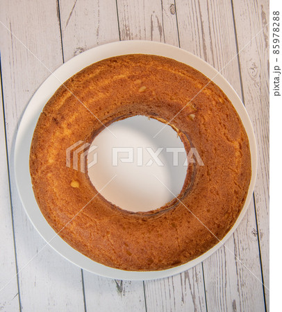 Pastry, Traditional Italian rum cake with whipped cream and raspberries 85978288
