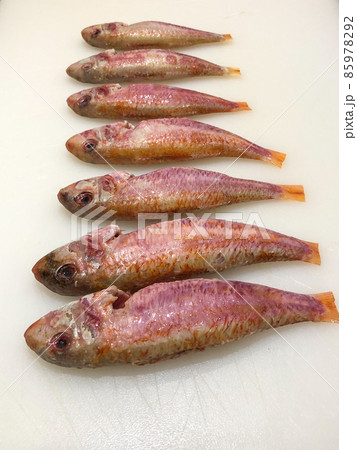 Raw red mullet fillets close-up on white background 85978292