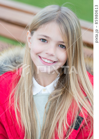 Child with blond long hair smile outdoor Child with blond long hair smile outdoor 85980613